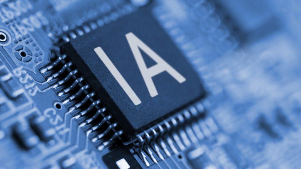 Close-up of a black computer chip labeled "AI" on a circuit board.